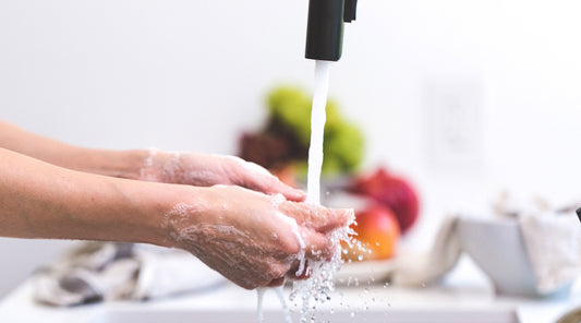 Washing hands in sink