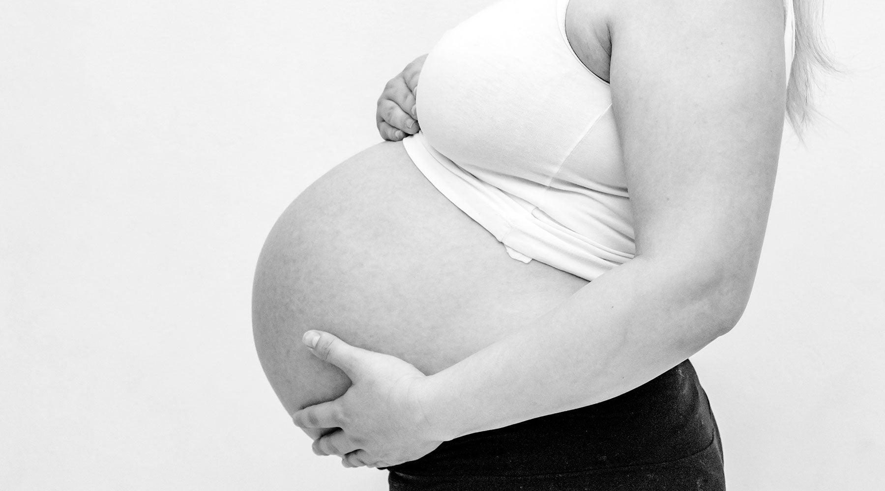 Woman Holding Her Baby Bump